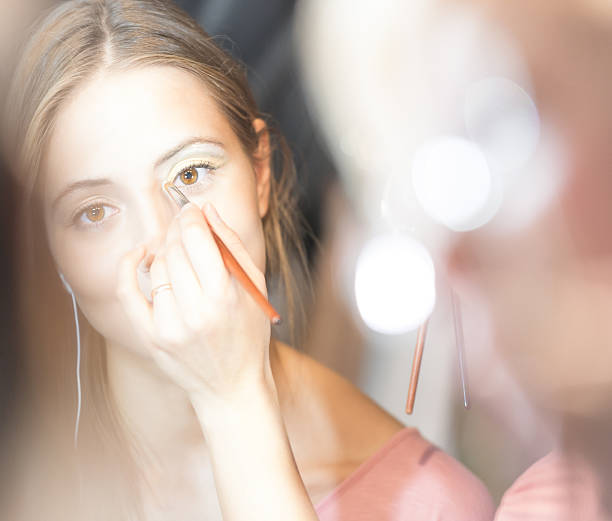 istock Young pretty woman getting make-up with brush. 162052898