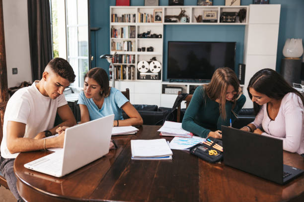 istock Group of teenage students studying at home 1620533256
