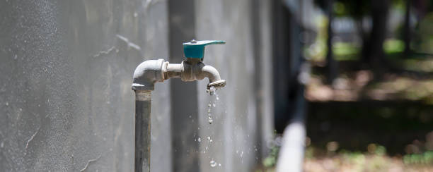 istock Exterior dripping water faucet or tap in yard 1620533281