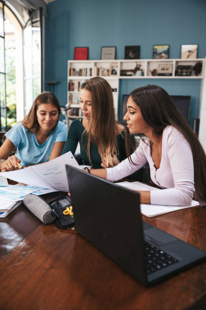 istock Group of teenage students studying at home 1620533504