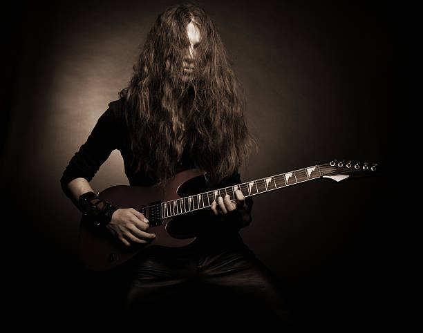 Furious metal guitarist stock photo