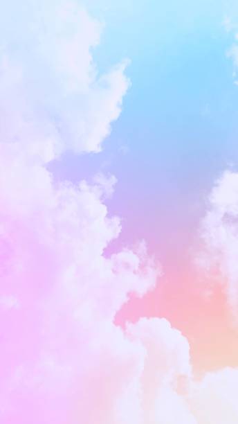 istock rainbow gradient background  Soft pastel colors and subtle blends of pinks, yellows, oranges and purples beautifully complement the atmospheric twilight sky and clouds and gentle white mist. 1620551570