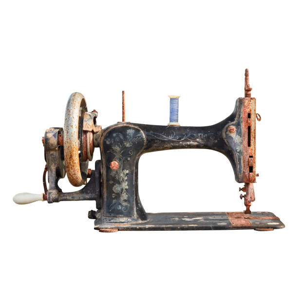 istock Vintage weathered and rusted sewing machine isolated on white 1620559100
