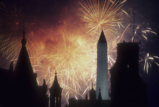 Fourth of July fireworks silhouette a Smithsonian building.