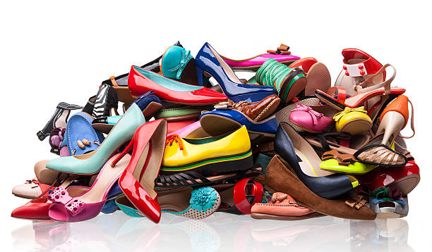 Pile of various female shoes stock photo