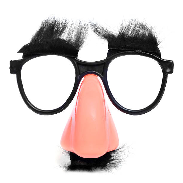 fake nose and glasses closeup of a fake nose and glasses, with mustache and furry eyebrows groucho marx disguise stock pictures, royalty-free photos & images