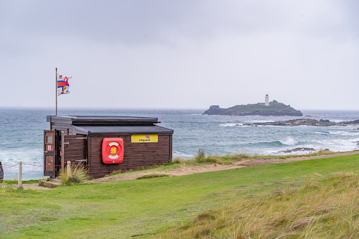RNLI watch point in the foreground with Godrevy Lighthouse captured in the background.