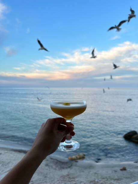 Photo background.Beautiful sky and  many birds and sea and one cocktail.