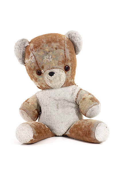 Worn Teddy Bear Old worn Teddy Bear on white background taxidermy stock pictures, royalty-free photos & images