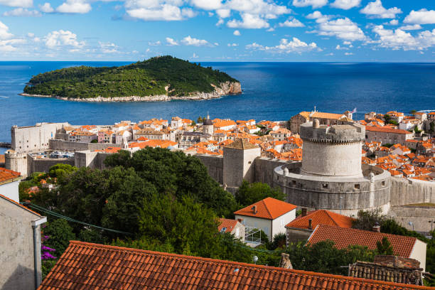 The old town of Dubrovnik and Roklum Island seen from the Mount Srdj, Croatia Dubrovnik is a charming coastal city in Croatia known for its medieval Old Town and beautiful sea views. The city has impressive walls and fortresses, and it was featured in "Game of Thrones." It's a top destination for history, culture, and beach lovers alike. fort minceta dubrovnik stock pictures, royalty-free photos & images