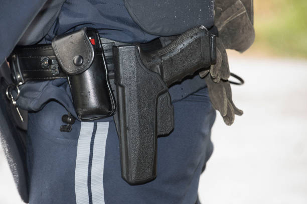 istock police officer with service weapon 1620602498