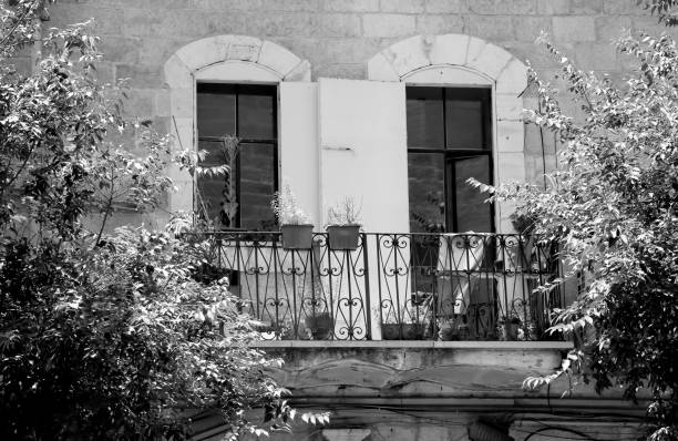 istock Beautiful wooden frame window in old building without people 1620604116