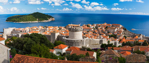 The old town of Dubrovnik and Roklum Island seen from the Mount Srdj, Croatia Dubrovnik is a charming coastal city in Croatia known for its medieval Old Town and beautiful sea views. The city has impressive walls and fortresses, and it was featured in "Game of Thrones." It's a top destination for history, culture, and beach lovers alike. fort minceta dubrovnik stock pictures, royalty-free photos & images
