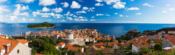 The old town of Dubrovnik and Roklum Island seen from the Mount Srdj in Croatia Dubrovnik is a charming coastal city in Croatia known for its medieval Old Town and beautiful sea views. The city has impressive walls and fortresses, and it was featured in "Game of Thrones." It's a top destination for history, culture, and beach lovers alike. fort minceta dubrovnik stock pictures, royalty-free photos & images