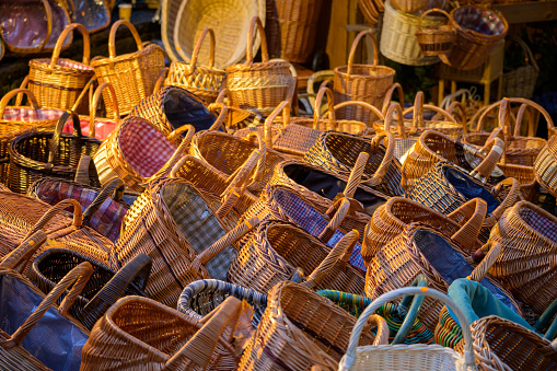 Hundreds of wicker baskets outside a stall on a Christmas market.