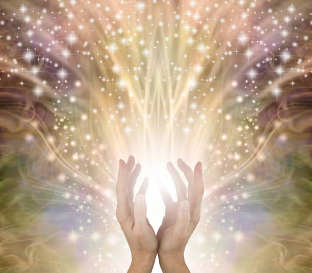 istock Golden Sparkling Magical Energy Healing Hands Sensing star light 1620633568