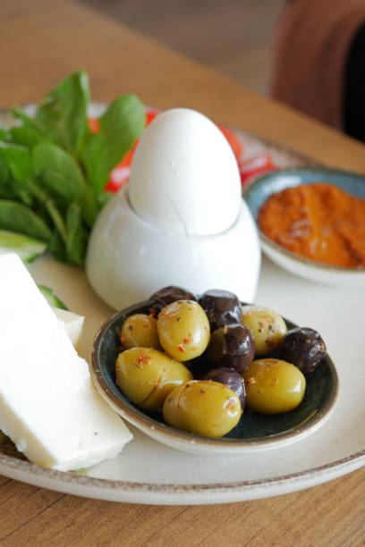 istock cheese tomato and olive on a plate 1620654759