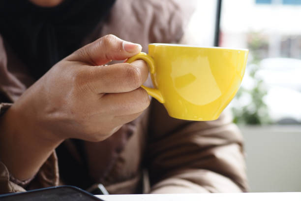 istock women holding a coffee cup 1620662124