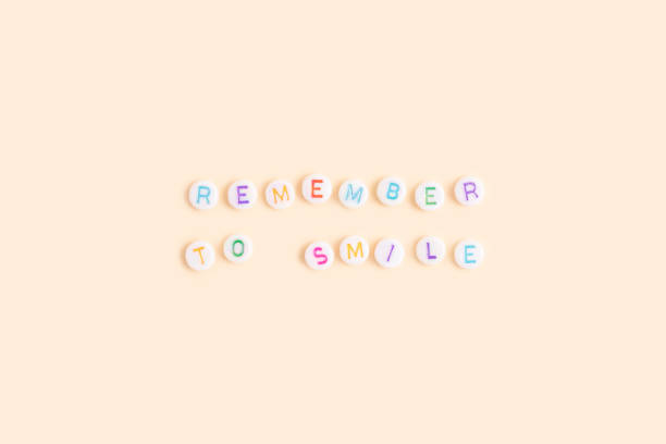 istock Quote Remember to smile made of round beads with multicolored letters. 1620664788