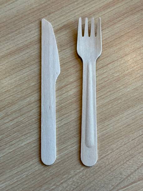 Disposable wooden fork and knife stock photo