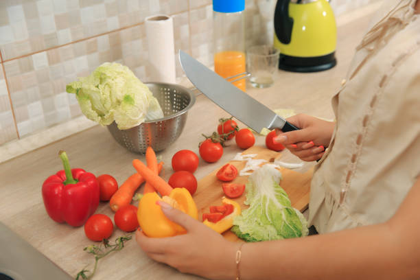 istock Girl cuts wax in the kitchen 1620690431