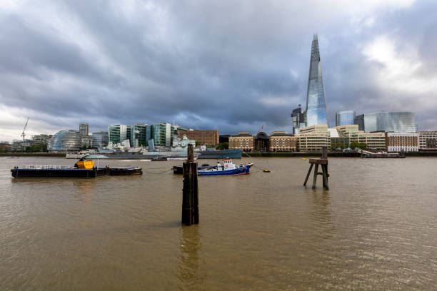 London, United Kingdom – Aug 14, 2023: A high-angle shot of the gloomy London skyline featuring The Shard in London, UK