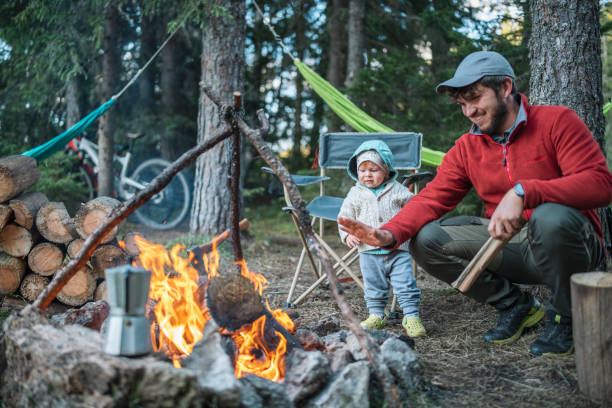 istock Son and father having fun on camping vacation. 1620717229