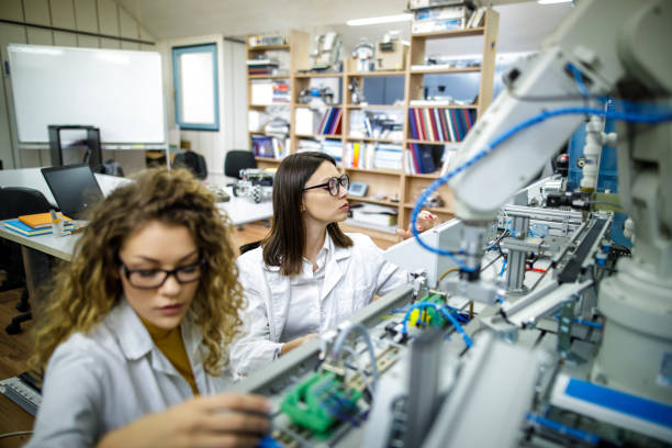 istock Female engineers examining new project in mechanical laboratory 1620780326
