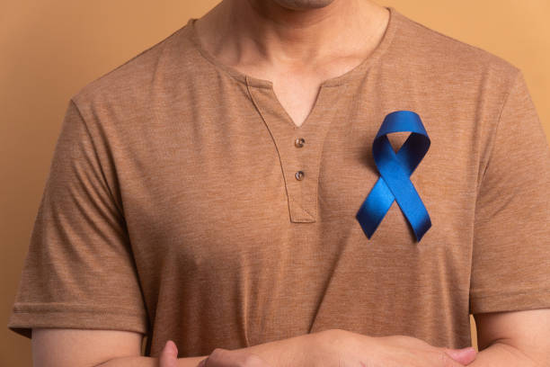 istock man showing blue ribbon 1620783686