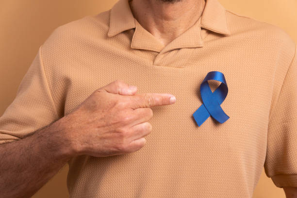 istock hands showing blue ribbon, awareness concept. 1620783699