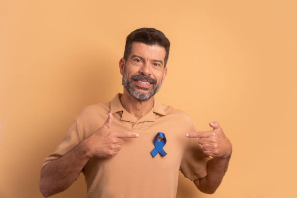 istock man showing blue ribbon. prostate cancer, awareness concept. 1620783700