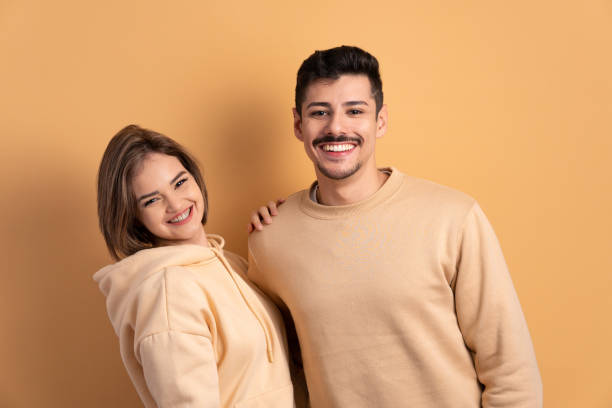 istock couple smiling and looking at camera 1620783730