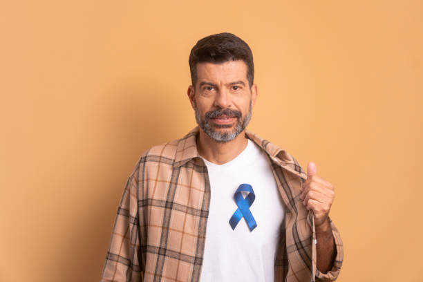 senior man showing blue ribbon