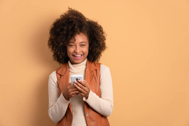 istock woman holding mobile cell phone 1620784313