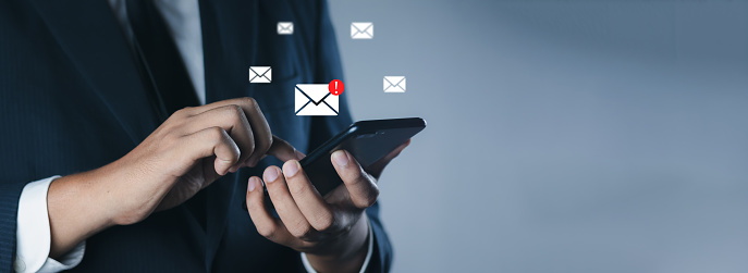 Business people touch on mobile phone. New email notification concept for marketing and business ideas through email, email or newsletter. Inbox receiving electronic message alert, sending e-mails.