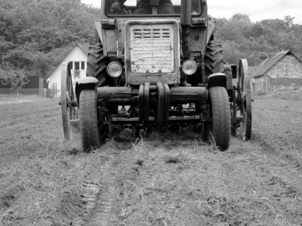 Big tractor with open door, isolated on white with drop shadow.