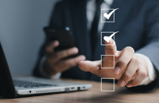 istock Digital smart check list, Businessman use laptop and touching marking on checklist assessment paperless office and document management and future business , questionnaire, evaluation. 1620789845