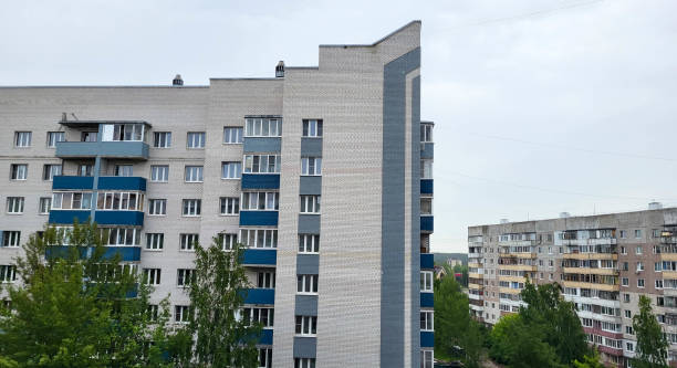 istock Beautiful facade of a brick house with balconies and a high sharp angle. 1620790403