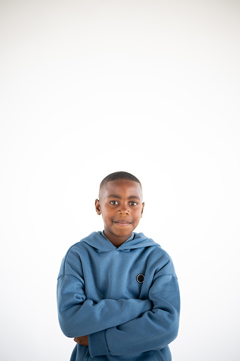 Portrait of cute young African boy in studio