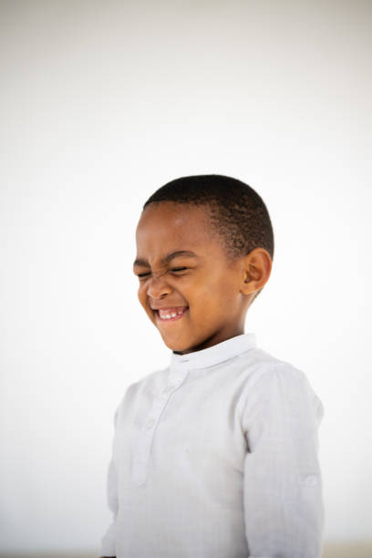istock Little boy with his eyes shut waiting for a surprise 1620802161