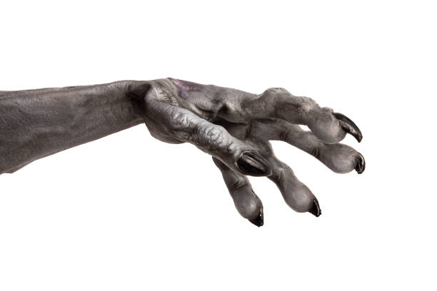 A spooky monster hand cut out on a white background.