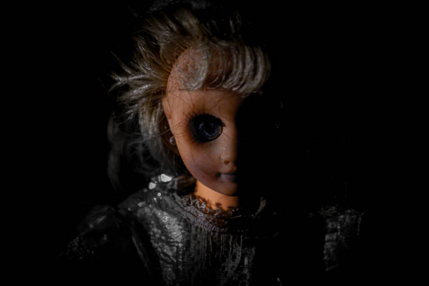 istock Vintage evil spooky doll in the darkness. 1620809192