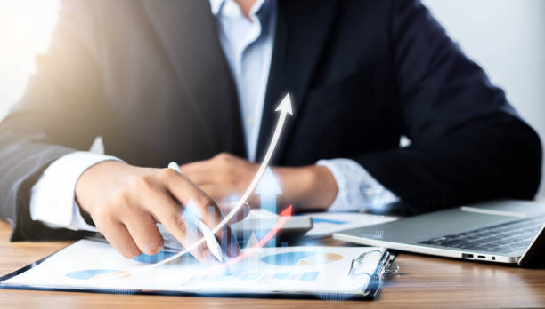 istock Businessman analyzing financial data for growth, read and write company performance reports, Financial analysis and planning and strategies to maximize sales profits. 1620820467