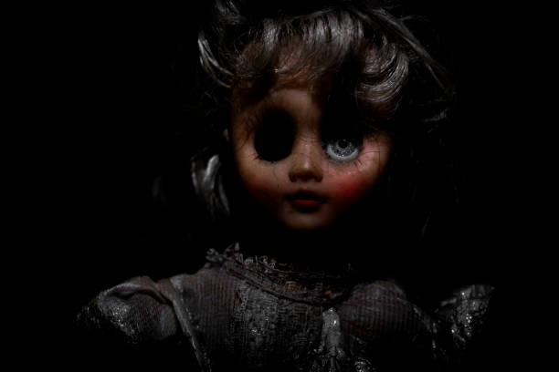 istock Vintage evil spooky doll in the darkness. 1620822409