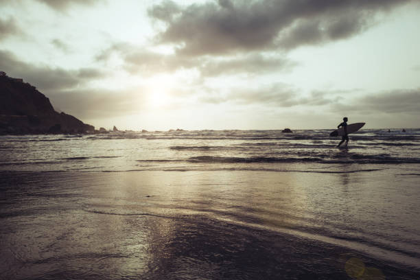 istock Surfers at sunset in Tenerife Canary Islands 1620845308