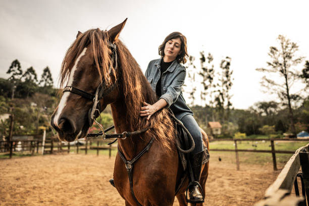 istock Young woman horse riding on a ranch 1620877213