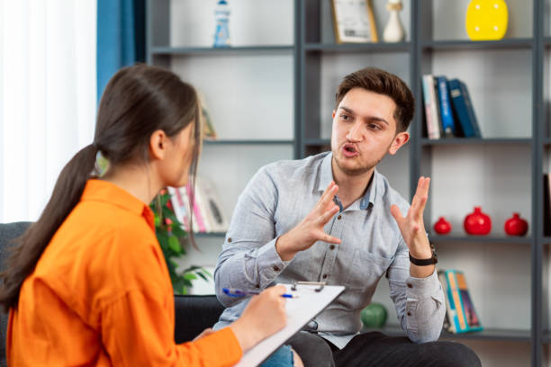 istock Man talking with psychotherapist in his office 1620887278