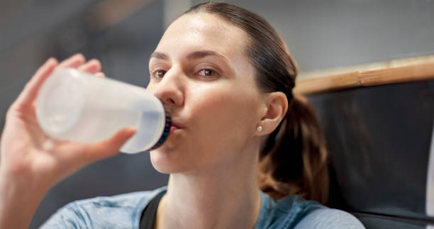 istock Athlete woman drinking water 1620887317