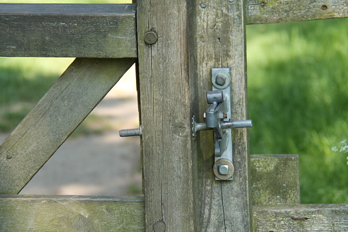 The Metal Catch on a Wooden Rural Countryside Gate.