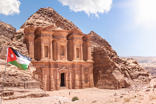 The Monastery, Petra, Jordan: The Monastery, also known as Ad Deir and also spelled ad-Dayr and el-Deir, is a monumental building carved out of sandstone in the ancient Jordanian city of Petra. The Monastery was probably carved in the mid-first century AD.